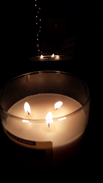 Reflecting lights... candle flames on a dark morning.