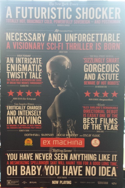 The movie poster in the theatre lobby....