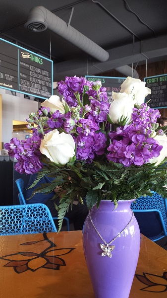 Anniversary flowers. We weren't home when the shop tried to deliver them, but we were near there, so we picked them up on our way to lunch. We brought them into the restaurant so they wouldn't perish in the heat of the car.