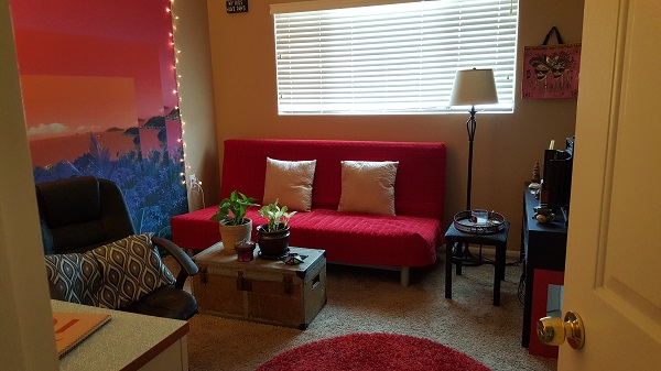 Window wall across from the doorway (with futon)