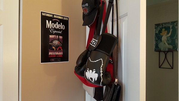 Behind the door (Lucha Libre poster, boxing gloves, bags, hats)