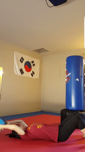 Medicine ball crunch (bottom)